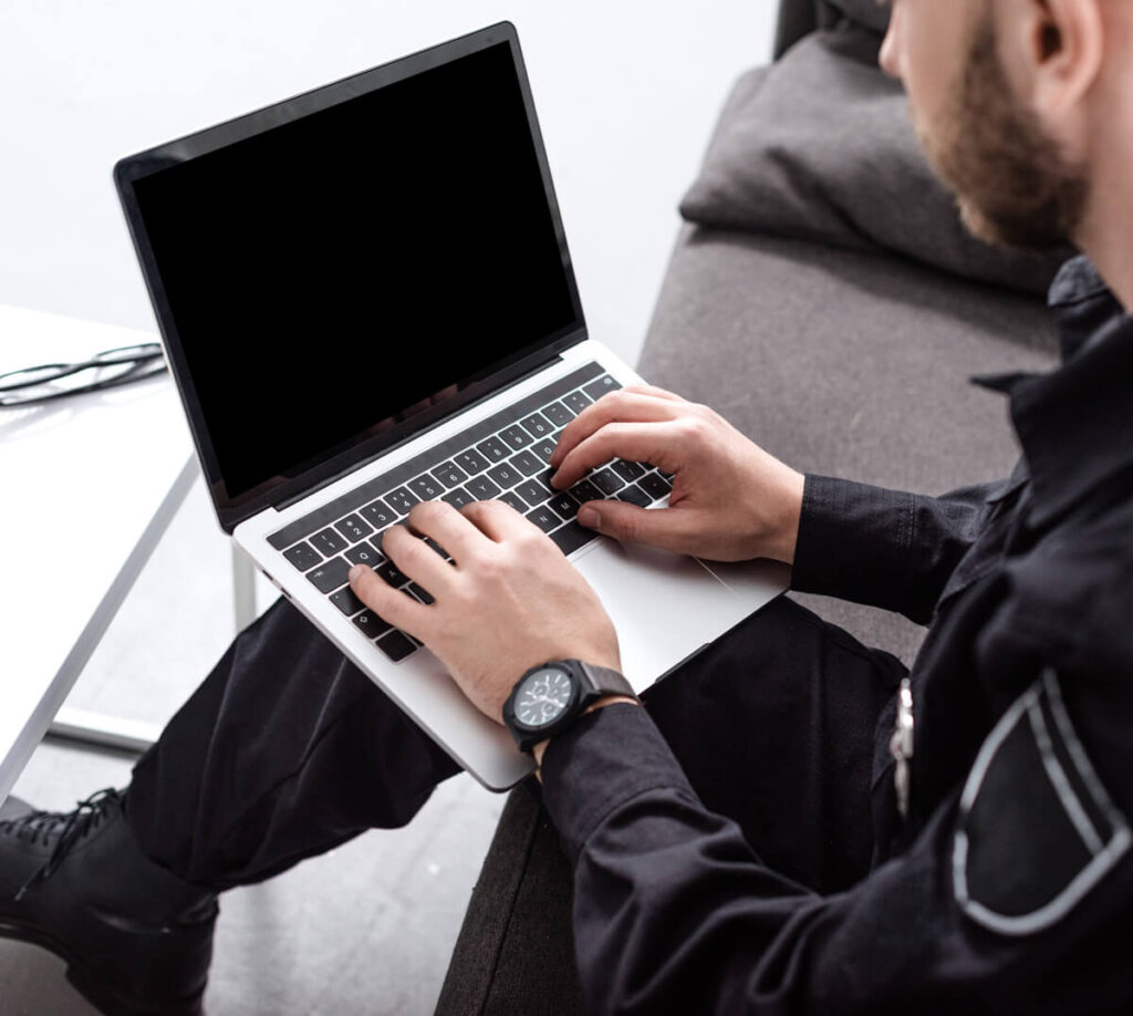 Police officer working on computer