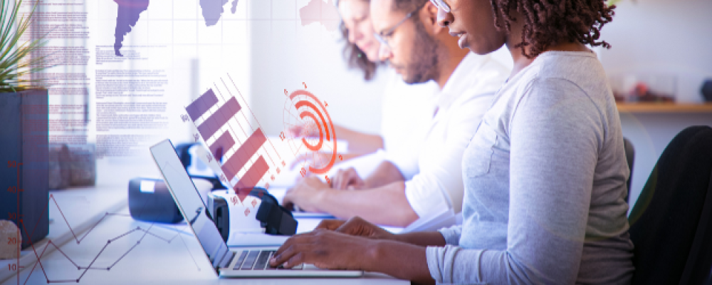 Image of people on computer representing IBM Cognos Analytics